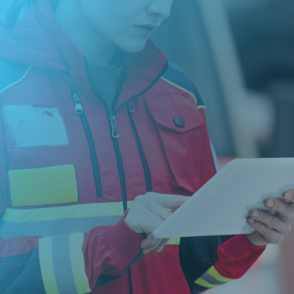 An emergency responder using a tablet that is managed and secured by the SOTI ONE Platform